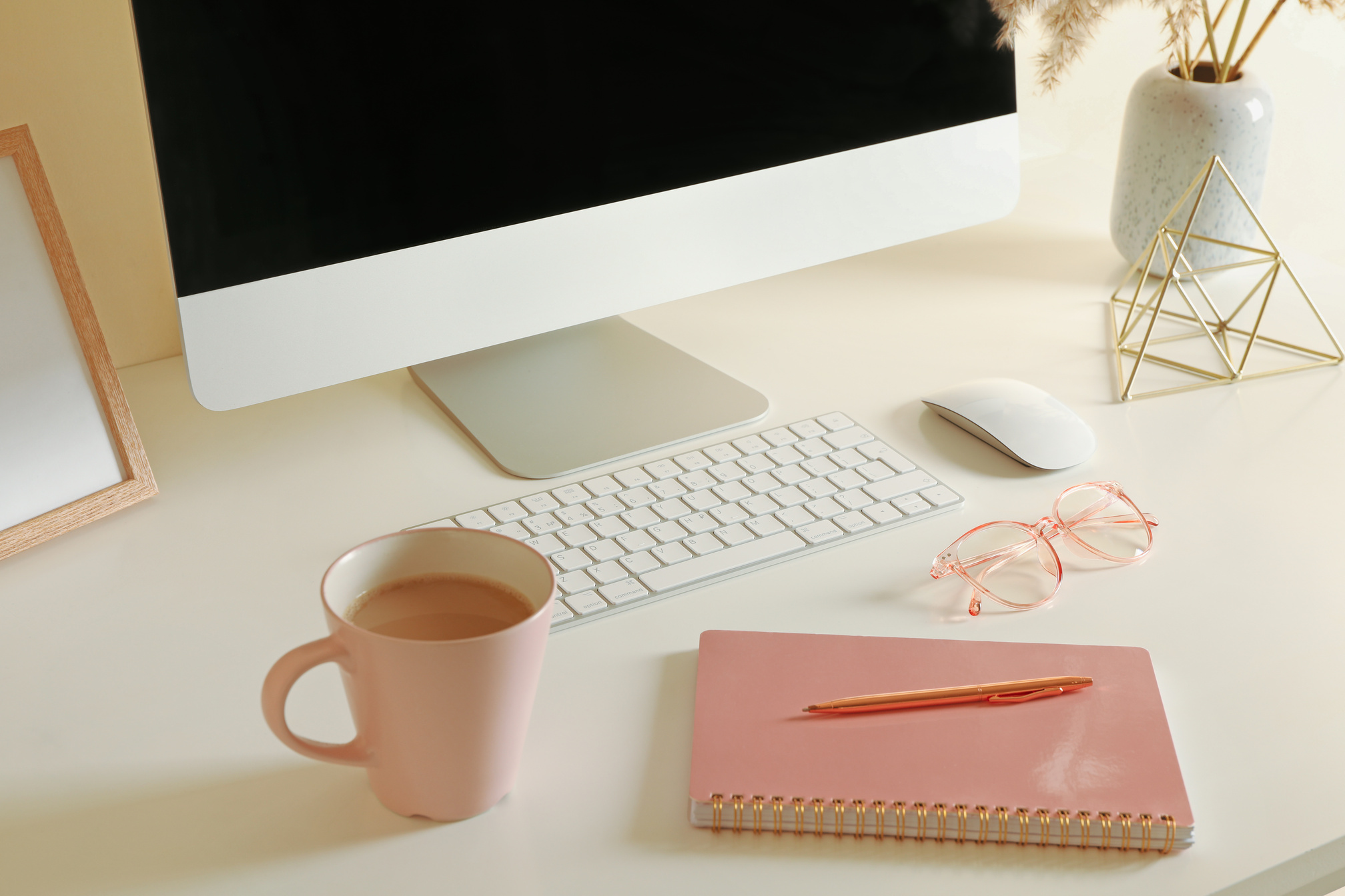 Coffee, Notebook, Pen, Eyeglasses, and Computer on Table